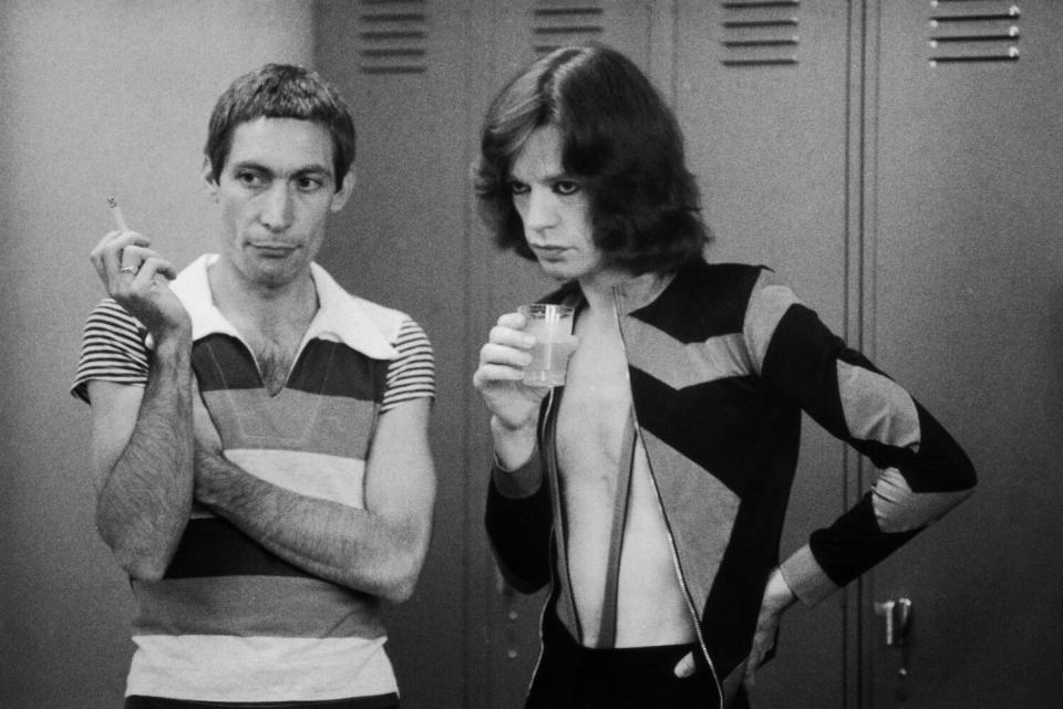 A black-and-white image of a young Charlie Watts, left, and Mick Jagger