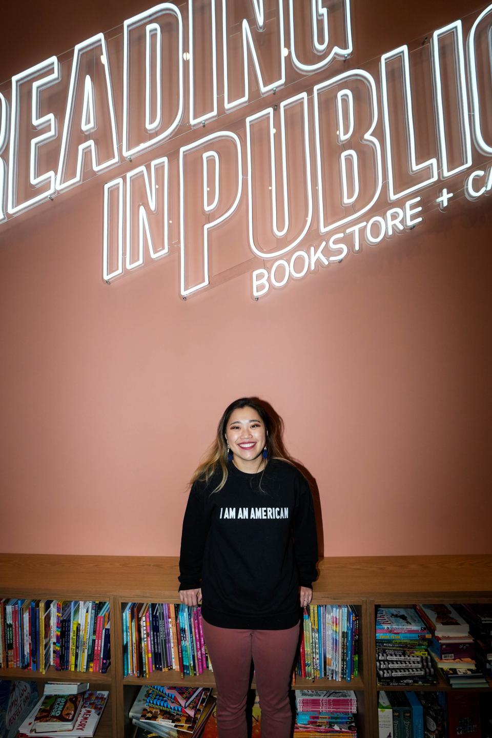 Linzi Murray, owner of Reading in Public Bookstore + Cafe, poses for a photo in her new bookstore in Valley Junction in West Des Moines on Friday, Jan. 13, 2023.