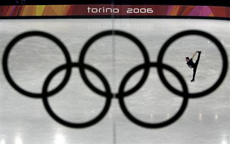 Shawn Sawyer of Canada is seen during a practice session through the Olympic rings at the Palavela figure skating venue ahead of the Torino 2006 Winter Olympic Games in Turin, Italy, February 9, 2006. REUTERS/David Gray