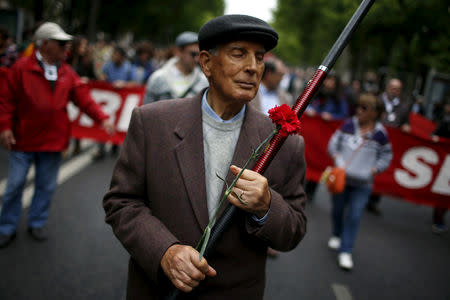 FILE PHOTO: A man walks during a march marking the Carnation Revolution's 41st anniversary in Lisbon April 25, 2015. REUTERS/Rafael Marchante/File Photo