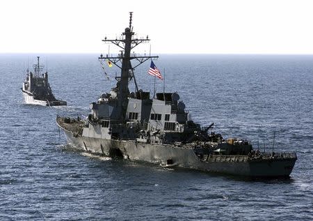 The U.S. Navy destroyer USS Cole (DDG 67) is towed away from the port city of Aden, Yemen, into open sea by the Military Sealift Command ocean-going tug USNS Catawba (T-ATF 168), in this file picture taken October 29, 2000. REUTERS/Sgt. Don L./USA Marine corps