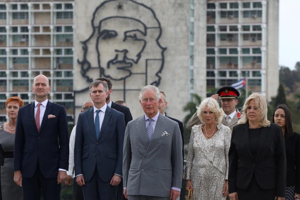Prince Charles and Camilla stand near an image of Che Guevara as they attend a wreath-laying ceremony at the Jose Marti monument (REUTERS)