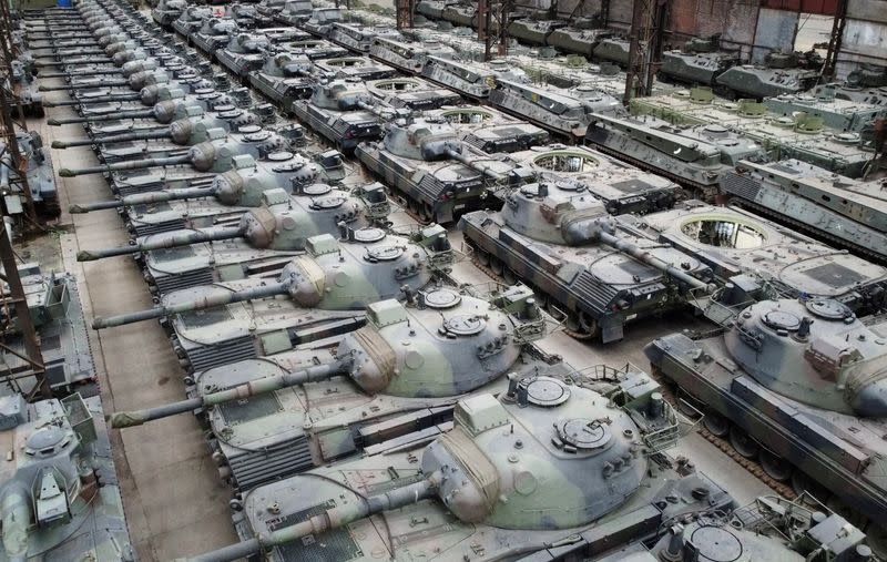 Dozens of German-made Leopard 1 tanks are seen in an hangar in Tournais