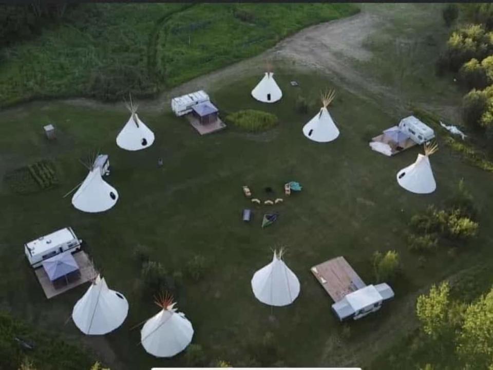  Kokum's Outreach, located on shore of Lesser Slave Lake in northwestern Alberta, has grown from one teepee in 2019 to nine in 2022.  (April Isadore/Facebook - image credit)