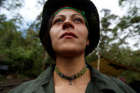 <p>Alexandra, a member of the 51st Front of the Revolutionary Armed Forces of Colombia (FARC), poses for a picture at a camp in Cordillera Oriental, Colombia, August 16, 2016. (John Vizcaino/Reuters) </p>