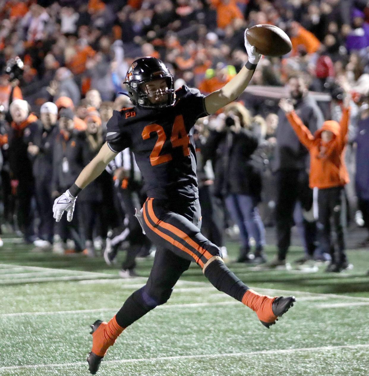 Massillon's Tyler Hackenbracht crosses the goal line after intercepting a Westerville South pass and returning it for a touchdown during a playoff game against Westerville South, Friday, Nov. 3, 2023 as Paul Brown Stadium.