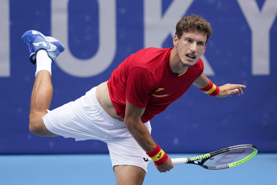 Pablo Carreno Busta, of Spain, serves to Karen Khachanov, of the Russian Olympic Committee, during the semifinal round of the men's tennis competition at the 2020 Summer Olympics, Friday, July 30, 2021, in Tokyo, Japan. (AP Photo/Patrick Semansky)