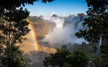 <p>If visiting Brazil is a once in a lifetime trip, make the most of your South America adventure by tacking on a trip to one of the world’s most awe-inspiring natural wonders—Iguazu Falls. The waterfall, which made Travel + Leisure’s list <a rel="nofollow noopener" href="http://www.travelandleisure.com/slideshows/the-worlds-most-spectacular-waterfalls/3" target="_blank" data-ylk="slk:of awe-inspiring waterfalls to see before you die;elm:context_link;itc:0;sec:content-canvas" class="link ">of awe-inspiring waterfalls to see before you die</a>, is comprised of 275 individual terraced falls that is poured over by 375,000 gallons of water per second. Designated as a UNESCO world heritage site the falls are one of the wonders of the natural world and sure to wow even the most jaded traveler.</p> <p>Hop a LATAM flight from Rio (or from Florianopolis or São Paulo, the closest big cities) to Foz do Iguaçu Airport. The national park that surrounds the Falls is expansive and filled with dazzling wildlife and spectacular vistas of the falls. Spend the day wandering the walkways that carry you up and through the falls and out onto St Martin’s Island and Devil’s Throat. There are boat rides to admire the falls from up close, too. For the full experience, book a room at the Belmond Hotel das Cataratas, which is the only hotel located within the Iguassu National Park, and just a two-minute from the falls.</p>