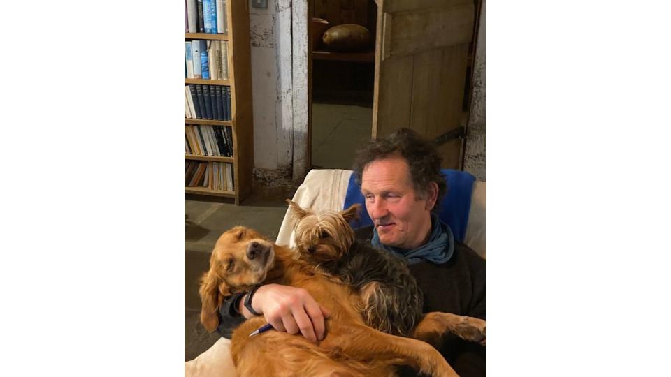 monty don stroking two pet dogs 