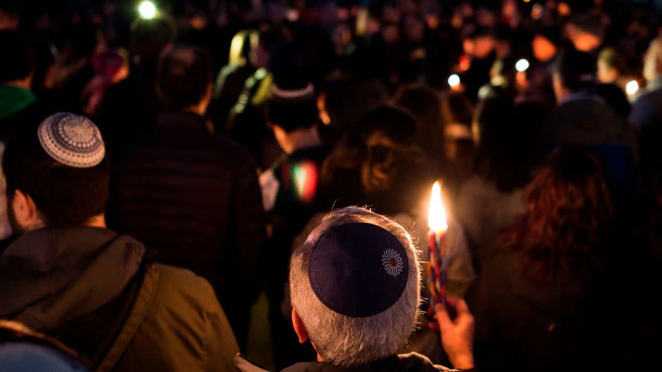 Members and supporters of the Jewish community come together for a candlelight vigil in remembrance of those who died during a shooting at the Tree of Life Synagogue in Pittsburgh. - Andrew Caballero-Reynolds/AFP/Getty Images/FILE