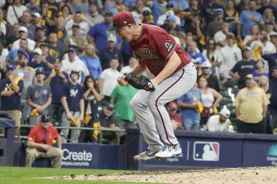 Arizona Diamondbacks relief pitcher Paul Sewald celebrates after the final out of Game 2 of their National League wildcard baseball series against the Milwaukee Brewers Wednesday, Oct. 4, 2023, in Milwaukee. The Diamondbacks won 5-2 to win the series. (AP Photo/Morry Gash)