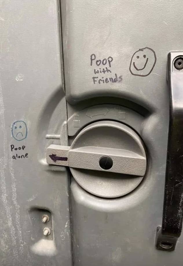 "Poop with friends" written in a portable toilet