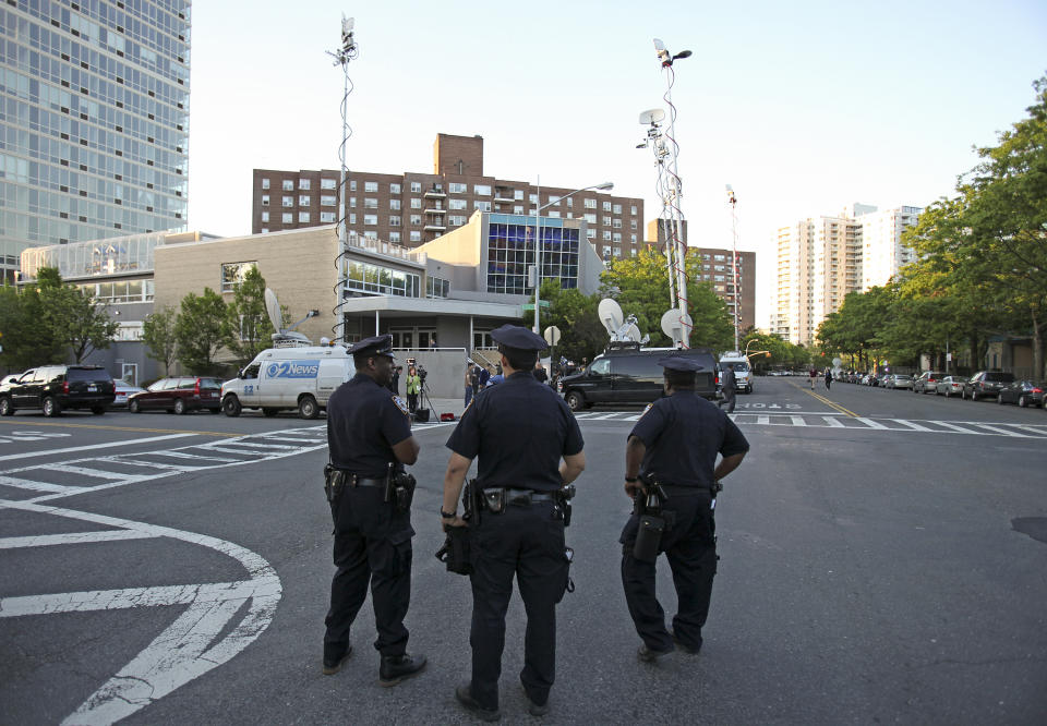 FILE - New York City police officers stand guard outside the Riverdale Jewish Center, on Thursday May 21, 2009, in the Bronx borough of New York. Four men, snared in an infamous post-9/11 terrorism sting, were ordered freed from prison Thursday, a judge finding that they had been "hapless, easily manipulated and penurious petty criminals" caught up in a plot driven by an overzealous FBI and a dodgy informant. (AP Photo/David Goldman, File)