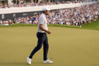 Scottie Scheffler celebrates after his putt on the 18th hole during the final round of the PGA Championship golf tournament at Oak Hill Country Club on Sunday, May 21, 2023, in Pittsford, N.Y. (AP Photo/Seth Wenig)