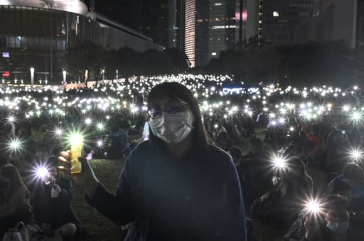 Tens of thousands of people in Hong Kong attended a peaceful vigil to mark the death of a 22-year-old student