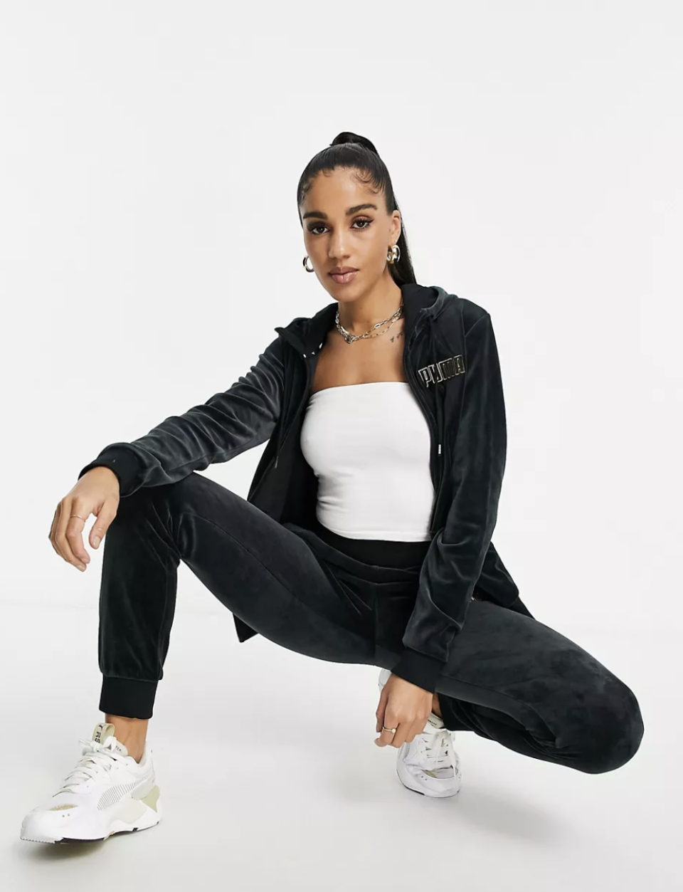 <p><strong>Puma</strong></p><p>ASOS</p><p><strong>$43.20</strong></p><p><a href="https://go.redirectingat.com?id=74968X1596630&url=https%3A%2F%2Fwww.asos.com%2Fus%2Fpuma%2Fpuma-velour-tracksuit-in-black-and-gold%2Fgrp%2F31910%3Fcolourwayid%3D60300500%26SearchQuery%3Dwomen%2Bhoodie%2321803916&sref=https%3A%2F%2Fwww.cosmopolitan.com%2Fstyle-beauty%2Ffashion%2Fg36448459%2Fbaddie-aesthetic-outfits%2F" rel="nofollow noopener" target="_blank" data-ylk="slk:Shop Now;elm:context_link;itc:0;sec:content-canvas" class="link ">Shop Now</a></p><p>Velour tracksuits are back and better than ever, baby. And this one from Puma is just so adorable. It'll look amaze with a white tube top and neutral-colored sneakers.</p>