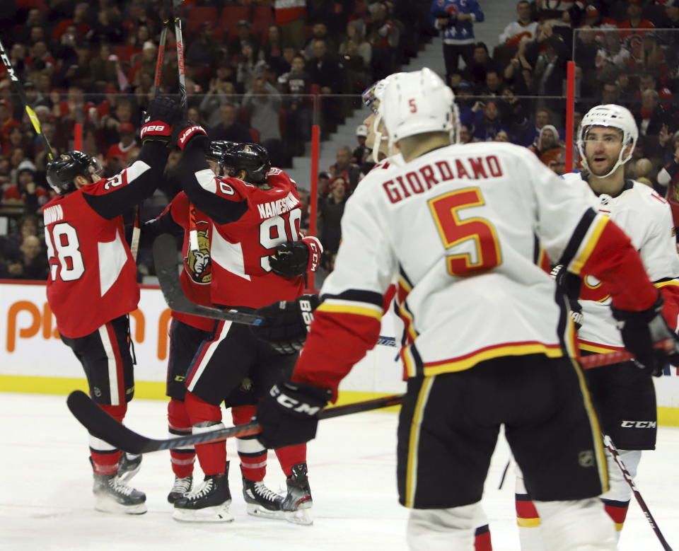 Ottawa Senators right wing Connor Brown (28) celebrates his goal with teammates during second-period NHL hockey game action against the Calgary Flames in Ottawa, Ontario, Saturday, Jan. 18, 2020. (Fred Chartrand/The Canadian Press via AP)