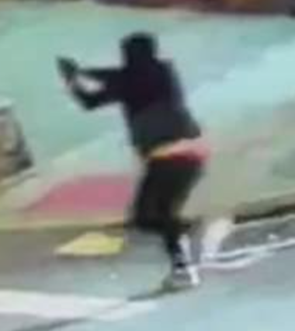 Surveillance footage captured a gunman opening fire in the Bronx on Wednesday, striking an 11-month-old girl as she sat in a car with her mother  (NYPD)