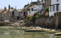 <p>The fishing village of Mousehole is nestled between Newlyn and Lamorna on the western coast of Cornwall. A quiant <a rel="nofollow noopener" href="http://no5mousehole.co.uk/" target="_blank" data-ylk="slk:cottage;elm:context_link;itc:0;sec:content-canvas" class="link ">cottage</a> with white-washed walls will provide a cosy night in after a day spent exploring the cobbled streets. <a rel="nofollow noopener" href="https://www.tripadvisor.co.uk/Restaurant_Review-g186238-d2091179-Reviews-Jessie_s_Dairy-Mousehole_Cornwall_England.html" target="_blank" data-ylk="slk:Jessie’s Dairy;elm:context_link;itc:0;sec:content-canvas" class="link ">Jessie’s Dairy</a> is an essential afternoon pit-stop for those craving a proper Cornish pasty and they’re undoubtedly best enjoyed by the harbour. While <a rel="nofollow noopener" href="https://www.shipinnmousehole.co.uk/" target="_blank" data-ylk="slk:The Ship Inn;elm:context_link;itc:0;sec:content-canvas" class="link ">The Ship Inn</a> is a local hotspot when rain is overhead. <em>[Photo: Getty]</em> </p>