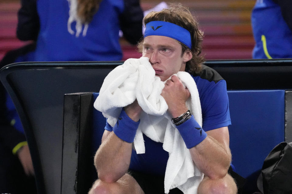 Andrey Rublev of Russia reacts during a break in his quarterfinal against Novak Djokovic of Serbia at the Australian Open tennis championship in Melbourne, Australia, Wednesday, Jan. 25, 2023. (AP Photo/Dita Alangkara)