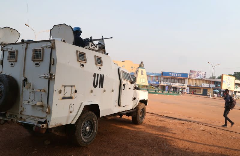 A MINUSCA armoured personnel carrier keeps guard while patroling the streets ahead of the upcoming elections in Bangui