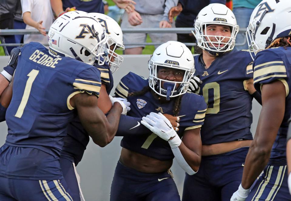 Akron wide receiver Alex Adams (7) celebrates his first-half TD catch against Morgan State on Saturday in Akron.