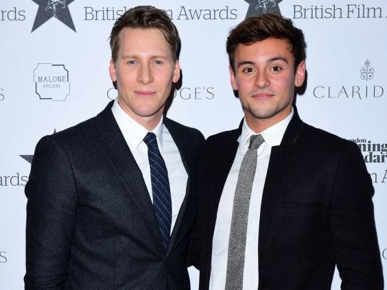 Tom Daley with his husband Dustin Lance Black (PA)