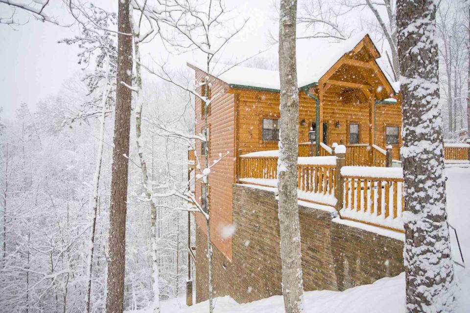 wbritten / Getty Images Cozy up in a Smoky Mountain cabin for a festive Christmas experience in East Tennessee.