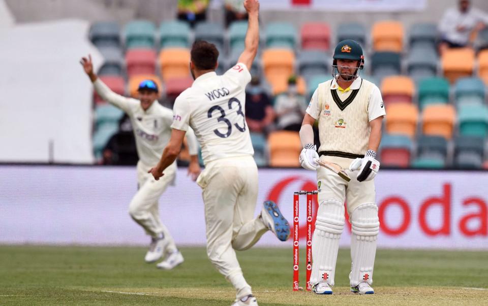 Mark Wood bags the wicket of Marcus Harris - AFP