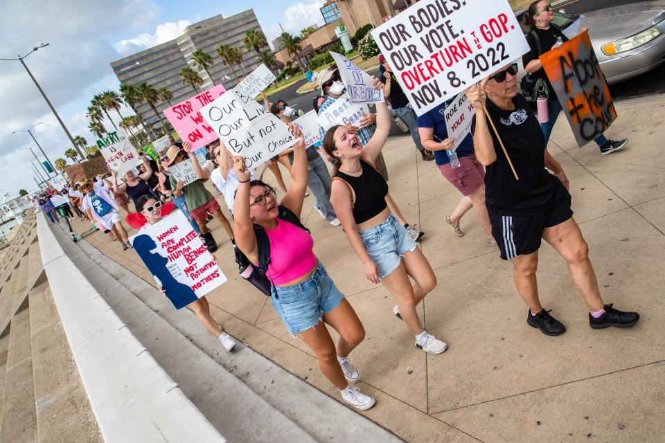 Demonstrators march down North Shoreline Boulevard on their way to the U.S. District Courthouse on Monday, July 4, 2022 in Corpus Christi.