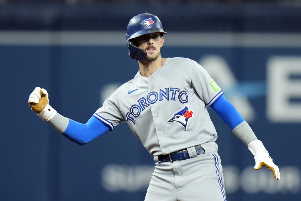 Toronto Blue Jays' Cavan Biggio celebrates his RBI double off Tampa Bay Rays relief pitcher Shawn Armstrong during the sixth inning of a baseball game Saturday, Sept. 23, 2023, in St. Petersburg, Fla. Blue Jays' Bo Bichette scored on the hit. (AP Photo/Chris O'Meara)