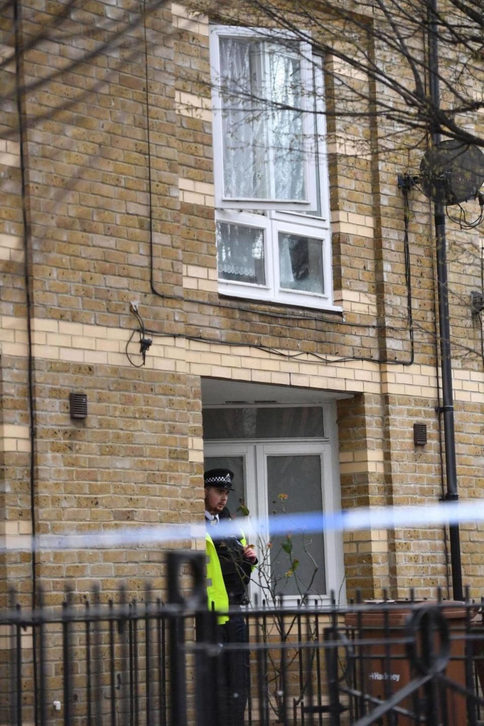 Shooting: An officer guards the property where a man was shot 13 times (PA)