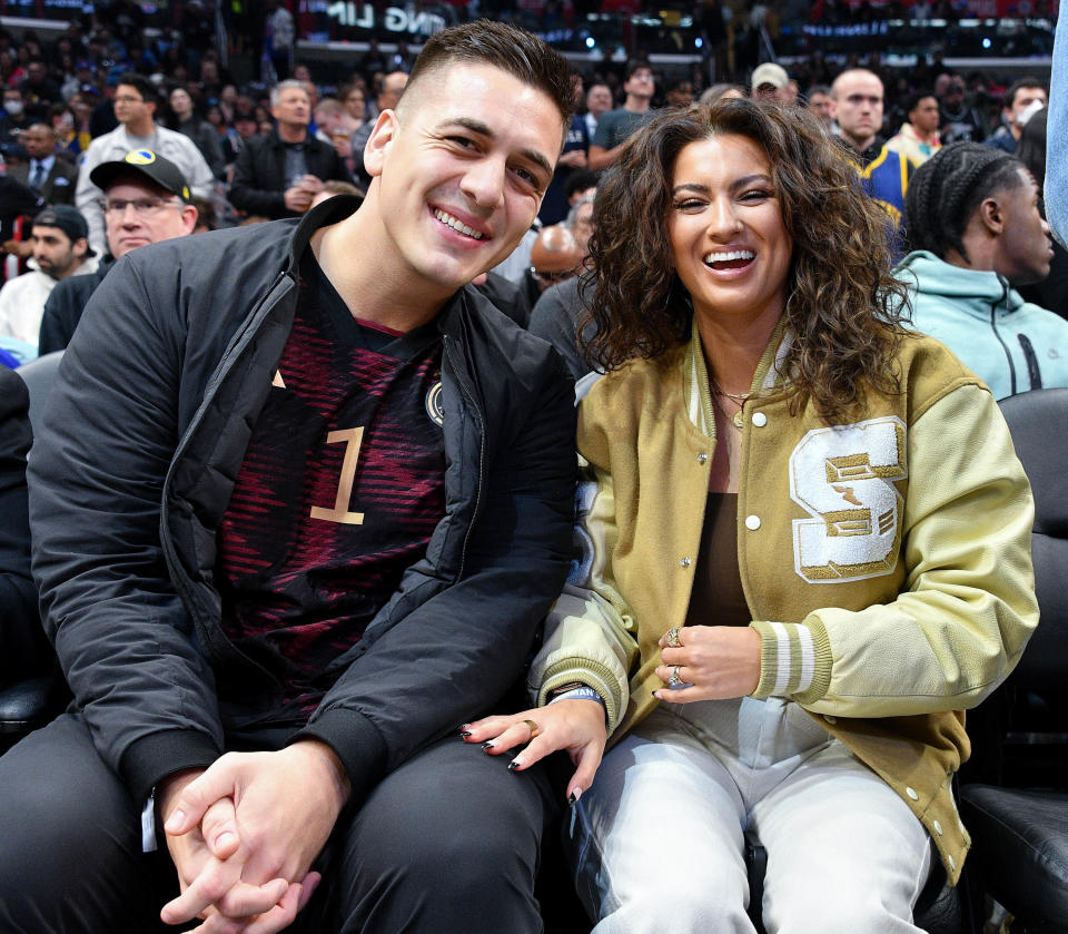 André Murillo and Tori Kelly attend a basketball game on March 15 at Crypto.com Arena in Los Angeles. (Photo: Allen Berezovsky/Getty Images)