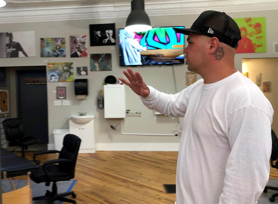 Htownink tattoo parlor owner Chris Garcia discusses the preparations his shop has made prior to reopening Monday, June 15. Monday was the first day personal services like salons and barbershops could reopen following Gov. Gretchen Whitmer's lockdown orders because of COVID-19.