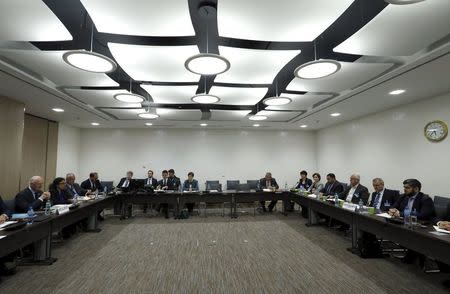 U.N. mediator Staffan de Mistura meets with the delegation of the High Negotiations Committee (HNC) during Syria Peace talks at the United Nations in Geneva, Switzerland, April 13, 2016. REUTERS/Denis Balibouse