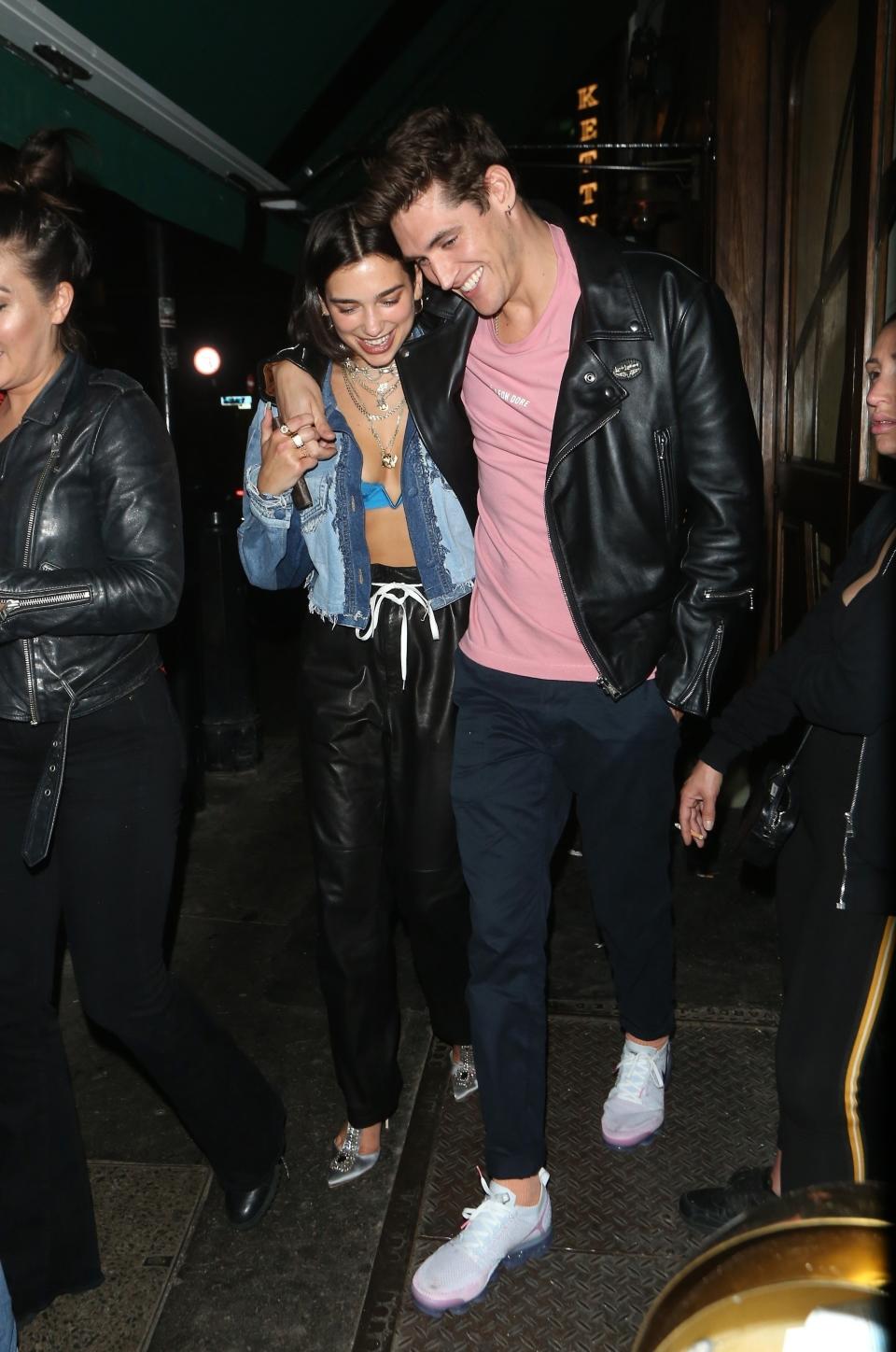 ** RIGHTS: ONLY UNITED STATES, BRAZIL, CANADA ** London, UNITED KINGDOM  - Pop star Dua Lipa shows off her curves in a tiny blue bralette as she cuddles up to her model beau Isaac Carew as they walk through SoHo, London. Dua was seen walking from SoHo House to The Box nightclub for a night of partying with her man.Pictured: Dua Lipa, Isaac CarewBACKGRID USA 30 MAY 2018 USA: +1 310 798 9111 / usasales@backgrid.comUK: +44 208 344 2007 / uksales@backgrid.comUK Clients - Pictures Containing ChildrenPlease Pixelate Face Prior To Publication