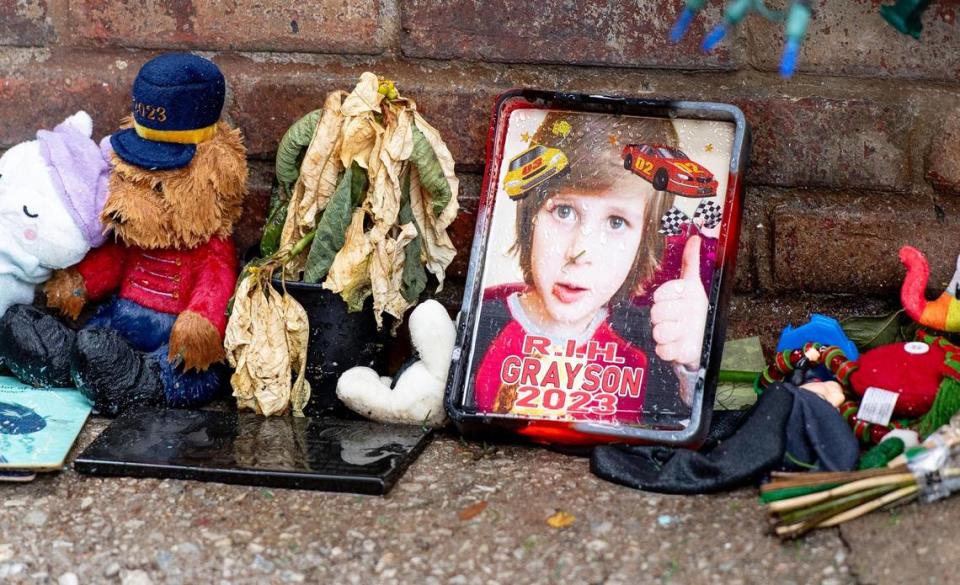 A photo of Grayson O’Connor marks a makeshift memorial on Dec. 27, 2023, in Kansas City. The 5-year-old boy was found dead in an alleyway outside of his downtown Kansas City apartment.