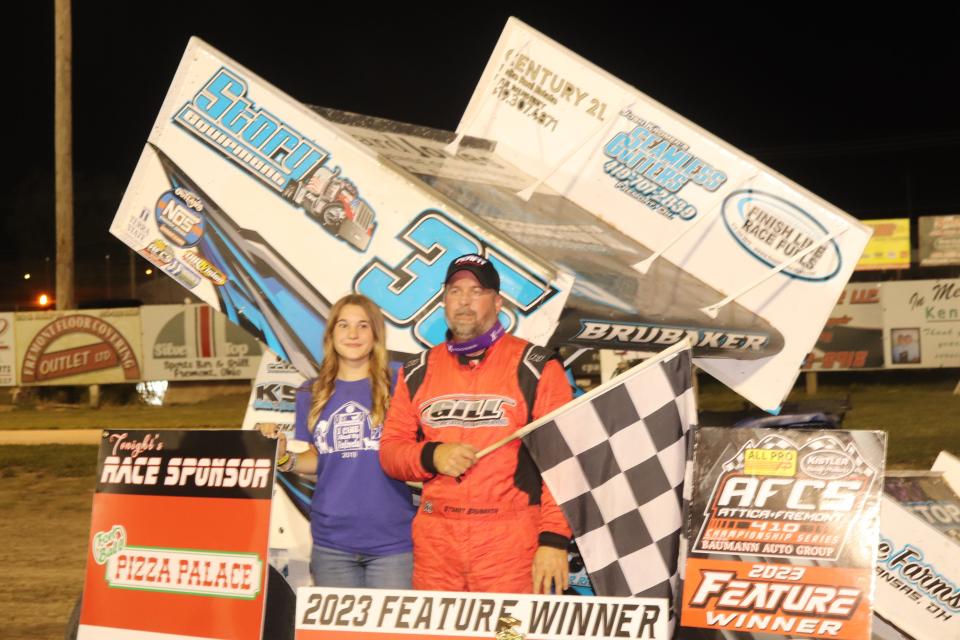 Stuart Brubaker, right, celebrates in Victory Lane with his daughter Gracie at Fremont Speedway.