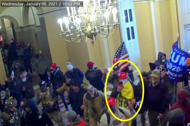 This image from U.S. Capitol Police video, released and annotated by the Justice Department in the sentencing memo for Christopher Ray Grider, shows Grider, circled in yellow, entering the U.S. Capitol on Jan. 6, 2021, in Washington. The Texas winery operator was sentenced on May 23, 2023, to nearly seven years in prison for storming the U.S. Capitol and joining an attack on the House chamber when police shot and killed another rioter. Grider also tried to cut power to the Capitol building during the riot. (Justice Department via AP)