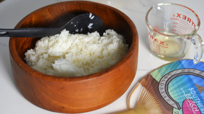 Making sushi rice in a wooden bowl 