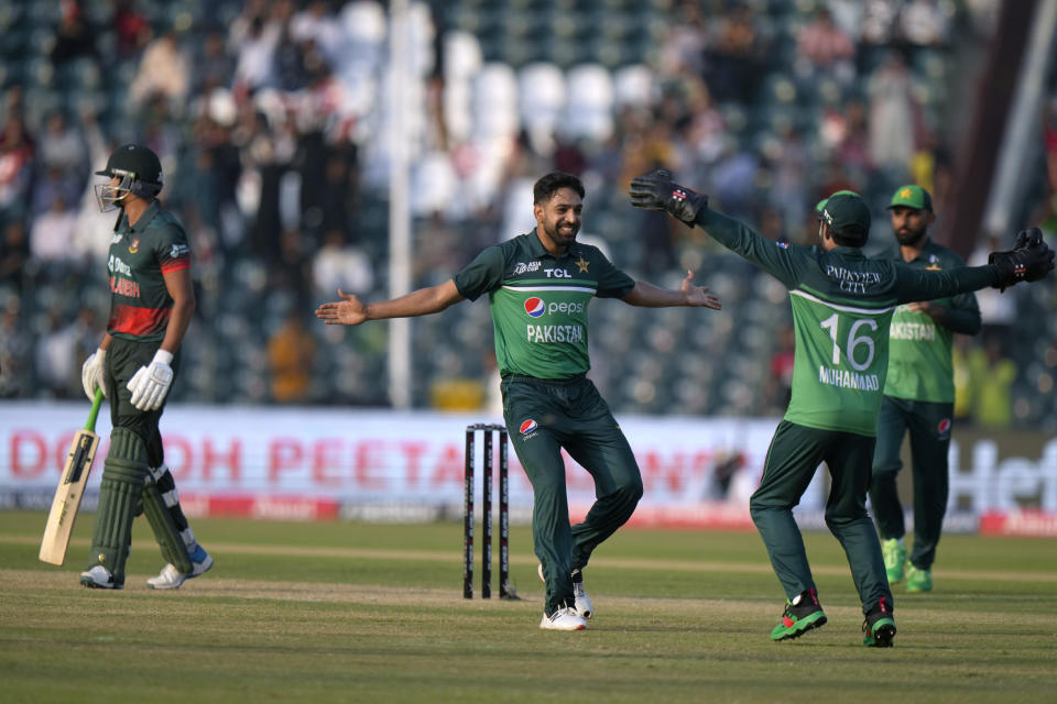 Pakistan's Haris Rauf, center, celebrates with teammates after taking the wicket of Bangladesh's Taskin Ahmed, left, during the Asia Cup cricket match between Pakistan and Bangladesh in Lahore, Pakistan, Wednesday, Sept. 6, 2023. (AP Photo/K.M. Chaudary)