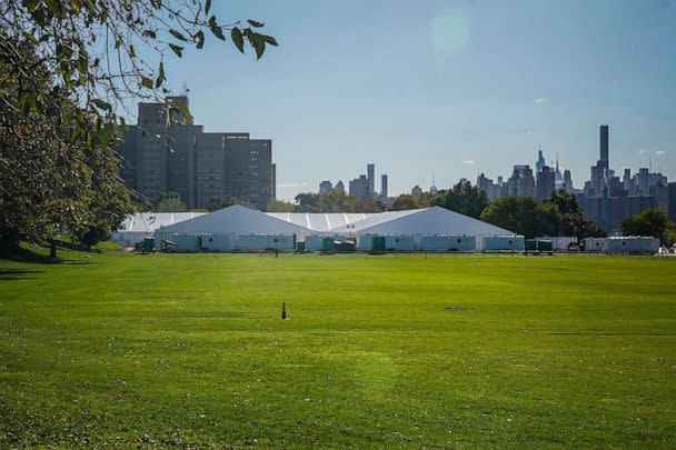 PHOTO: Randall's Island Humanitarian Emergency Response and Relief Center, center, a complex of giant tents, is New York City's latest temporary shelter for an influx of migrants bused into the city by southern border states, Oct. 18, 2022, in New York. (Bebeto Matthews/AP)