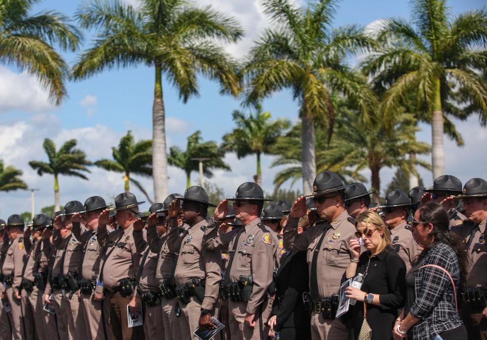 Florida Highway Patrol troopers stand outside of Christ Fellowship Church following the funeral of fallen trooper Zachary Fink, Monday, Feb. 12, 2024.