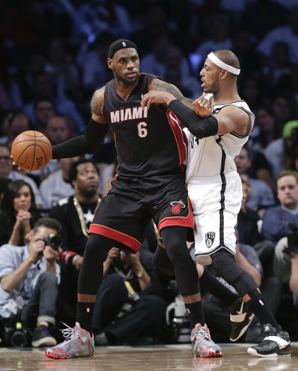 Miami Heat forward LeBron James (6) looks to drive against Brooklyn Nets forward Paul Pierce (34) in the third period during Game 3 of an Eastern Conference semifinal NBA playoff basketball game, Saturday, May 10, 2014, in New York. The Nets won 104-90. (AP Photo/Julie Jacobson)