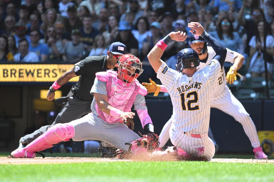 Brewers first baseman Rhys Hoskins is tagged out at home by Cardinals catcher Ivan Herrera tags as he tried to score from second on a base hit during the first inning Sunday at American Family Field.