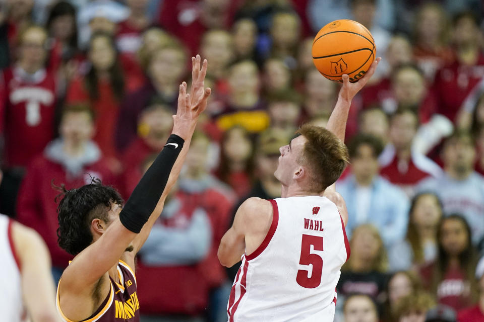 Wisconsin's Tyler Wahl (5) shoots against Minnesota's Dawson Garcia (3) during the first half of an NCAA college basketball game Tuesday, Jan. 3, 2023, in Madison, Wis. (AP Photo/Andy Manis)