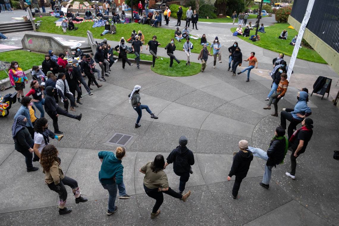 Students and community members dance a traditional Palestinian dance called dabke in support of pro-Palestinian protesters barricaded inside Siemens Hall at Cal Poly Humboldt in Arcata on Tuesday. Paul Kitagaki Jr./pkitagaki@sacbee.com