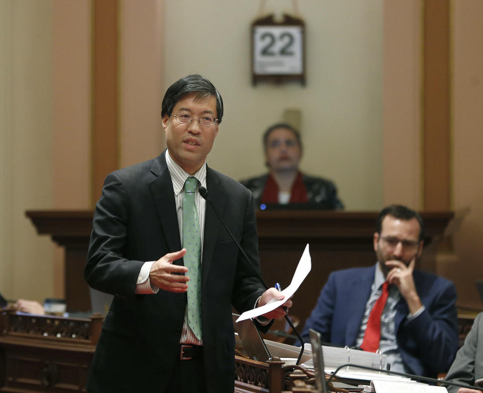 FILE - In this May 22, 2019, file photo, State Sen. Richard Pan, D-Sacramento, left, calls on lawmakers to approve his measure to toughen the rules for vaccination exemptions in Sacramento, Calif. California Gov. Gavin Newsom and the state lawmaker have agreed to limit the role of public health officials in approving doctors' vaccine decisions. But the health officials will increase their oversight of doctors and schools with high numbers of medical exemptions. Pan announced the changes Tuesday, June 18 after Newsom said he had doubts about giving state public health officials instead of local doctors the authority to decide which children can skip their shots before attending school. (AP Photo/Rich Pedroncelli, File)