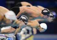 US swimmer Ryan Lochte (c) takes the start of the final of the men's 400-metre individual medley swimming event in the FINA World Championships at the indoor stadium of the Oriental Sports Center in Shanghai on July 31, 2011. Lochte won the race and claimed his fifth gold of the championships in 4min 7.13sec. AFP PHOTO / FRANCOIS XAVIER MARIT (Photo credit should read FRANCOIS XAVIER MARIT/AFP/Getty Images)