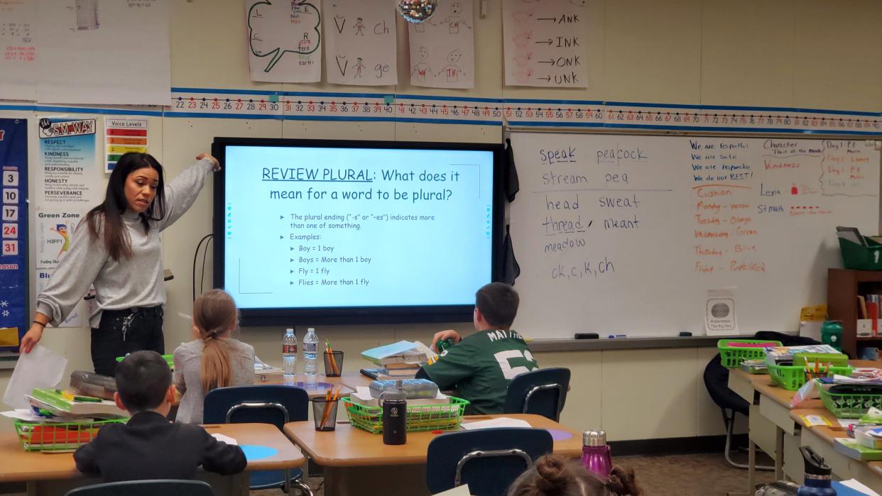 Blakewood Elementary Reading Specialist Renee Larsen works on spelling with South Milwaukee third grade students in December. The School District of South Milwaukee School Board passed a resolution calling the state budget plan "inadequate, inequitable and hurtful."